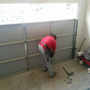 MGA garage door technician installing garage door in South Houston