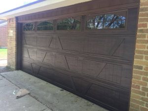 brown wooden garage door with windows