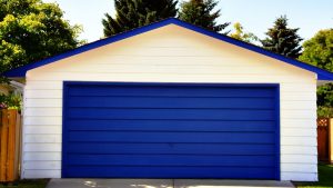 A blue garage door owned by a homeowner who asked, 